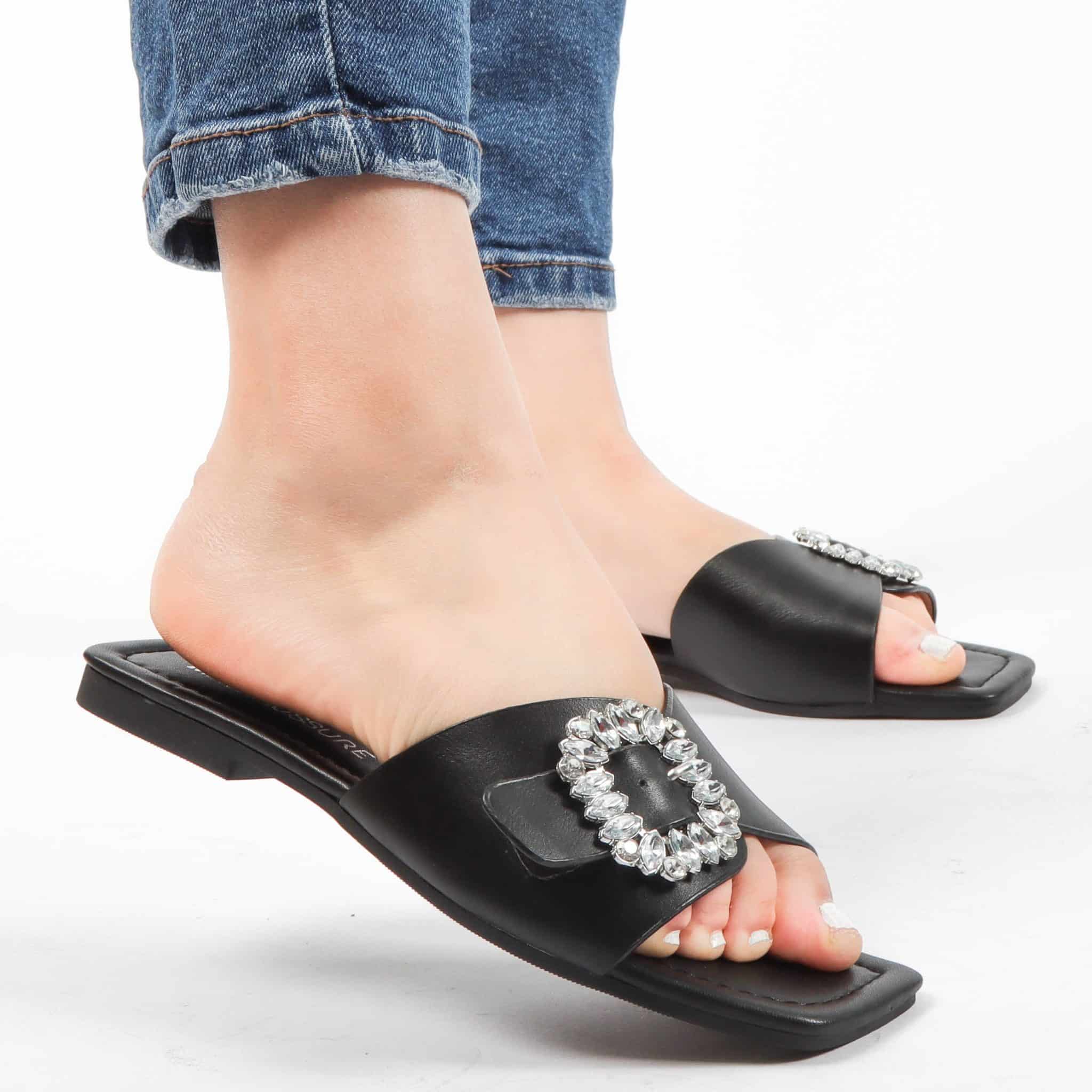 Reya – Sandales plates en Noir.