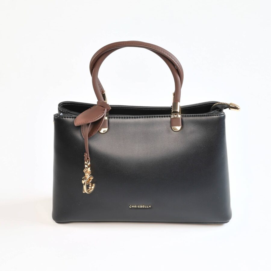 Sac à main en cuir noir avec poignées marron, idéal pour un style chic et sophistiqué..