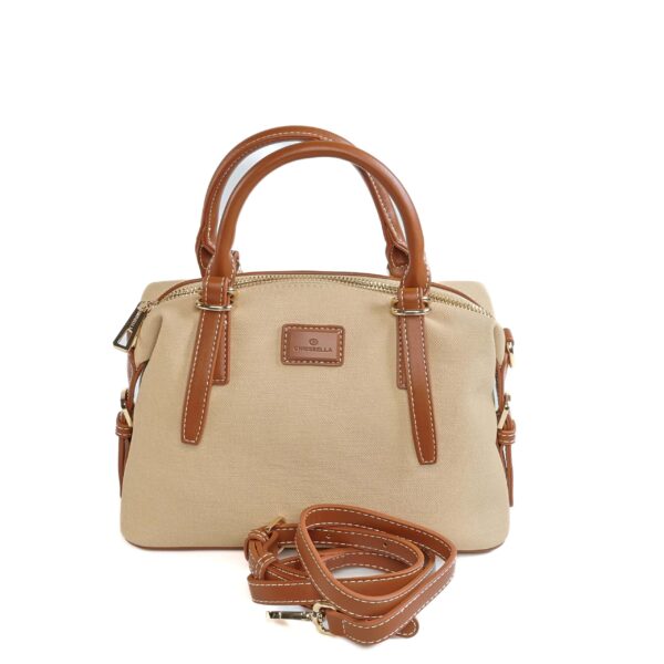 Sac à main beige avec poignées en cuir marron et bandoulière amovible, idéal pour un style élégant e..