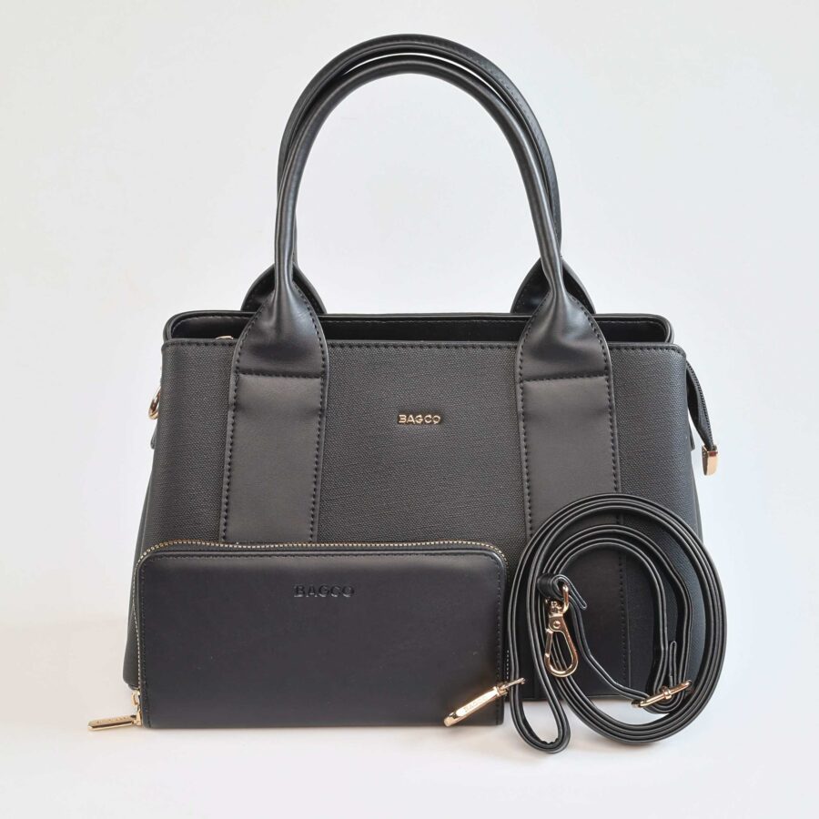 Sac à main en cuir noir avec poignées et accessoires dorés, idéal pour un style chic et sophisti..