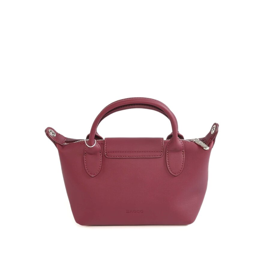 Sac à main en cuir rose foncé, idéal pour femmes, avec poignée robuste et fermeture zippée..